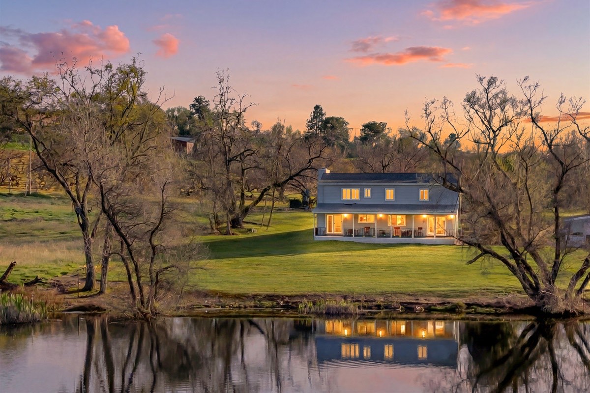 The Landing at sunset reflected in a pond