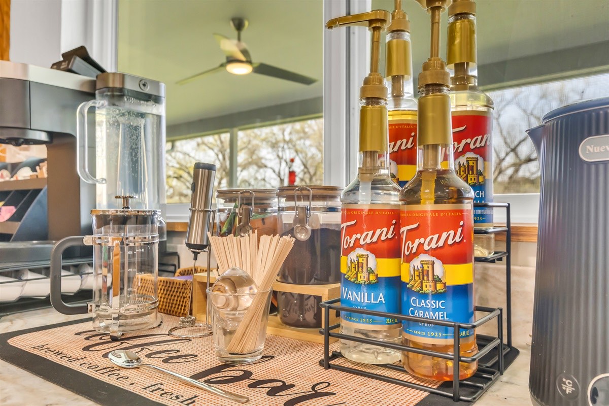 You start the morning at the coffee bar, pressing fresh coffee while the smell of beans and warm light fills the room.